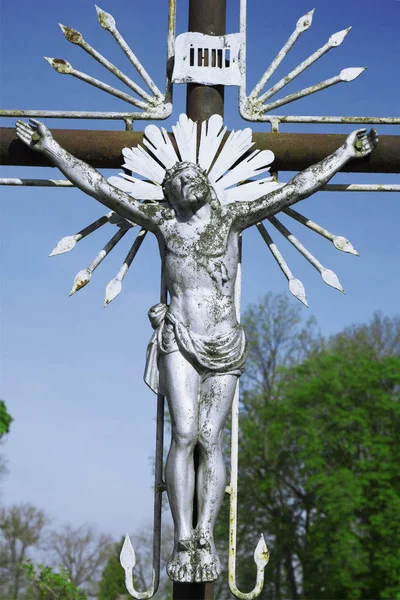 the crucifixion of Jesus Christ as a symbol of God\'s love (Old metal statue)