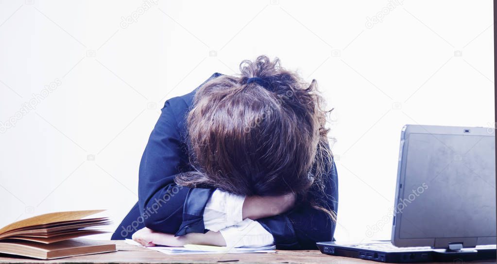 I want to sleep. Young business woman tired from office work with documents. Low wages, overtime working hours, lack of career prospects concept. (Body language, gestures, psychology concept)