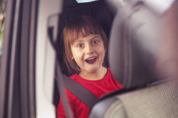 Safety and security concept. Happy cute little child girl sittin — Stock Photo, Image