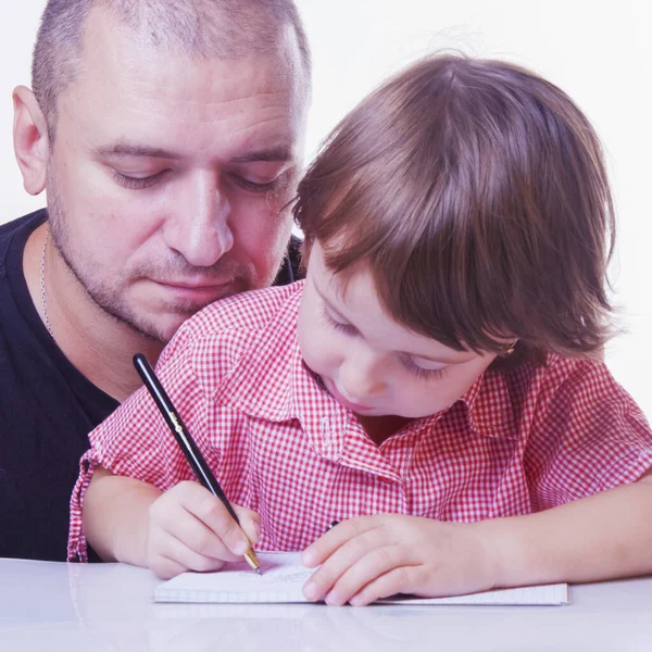 Father helping his  little daughter with homework. Education, sc — Stock Photo, Image