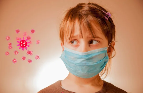 Prevention during flu and infectious outbreak. Cute little child girl in blue medical protective mask.