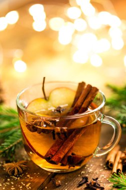 Mulled cider with cinnamon, cloves and anise. Traditional Christmas drink clipart