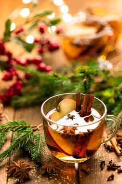 Mulled cider with cinnamon, cloves and anise. Traditional Christmas drink clipart