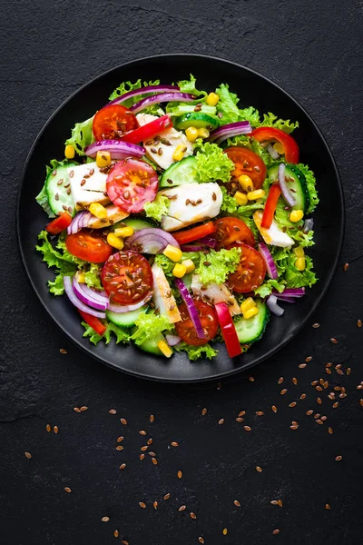 Vegetable salad with chicken meat. Salad with chicken breast and raw vegetables