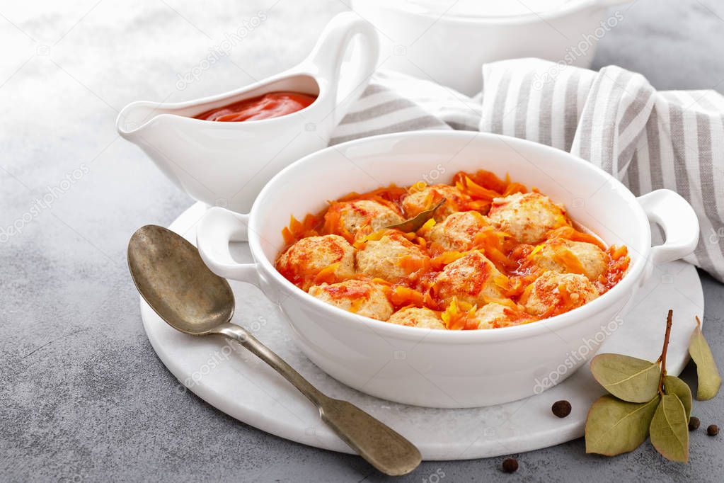 Fish meatballs in tomato sauce with carrot