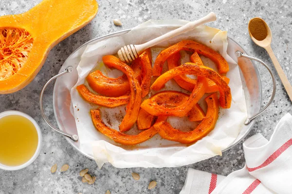 Baked sweet pumpkin with honey and cinnamon