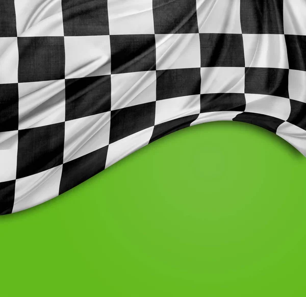 Checkered black and white flag on green background. Copy space