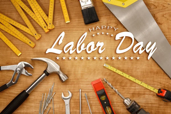 Happy Labor Day. Tools on wood