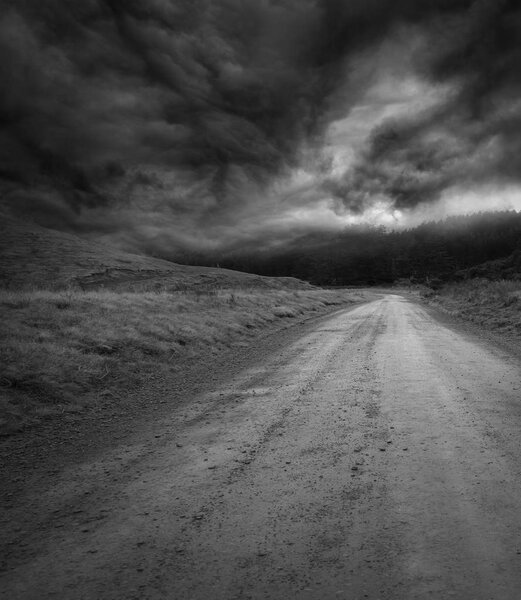Empty road and dark sky