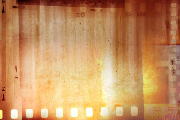 オレンジ色の背景に映画の負のフレーム — ストック写真