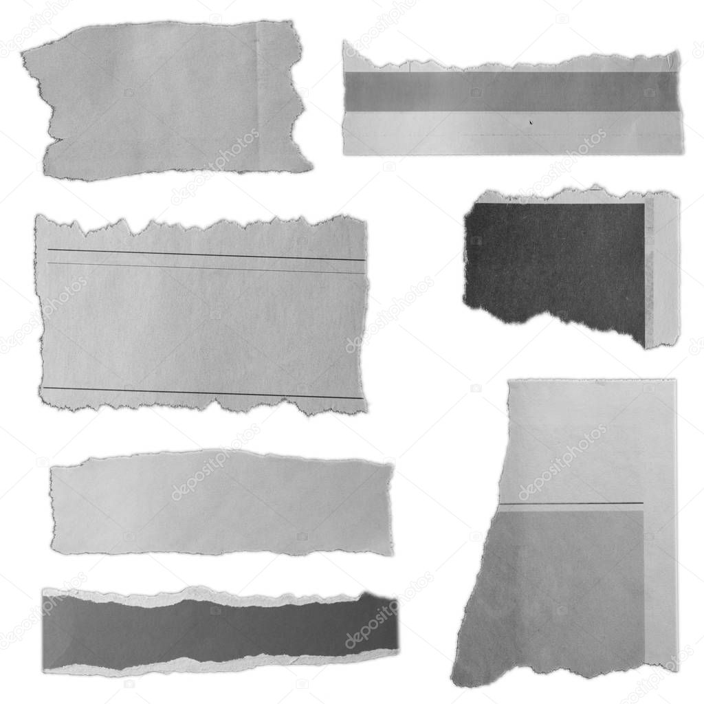 Seven pieces of torn paper on plain background 