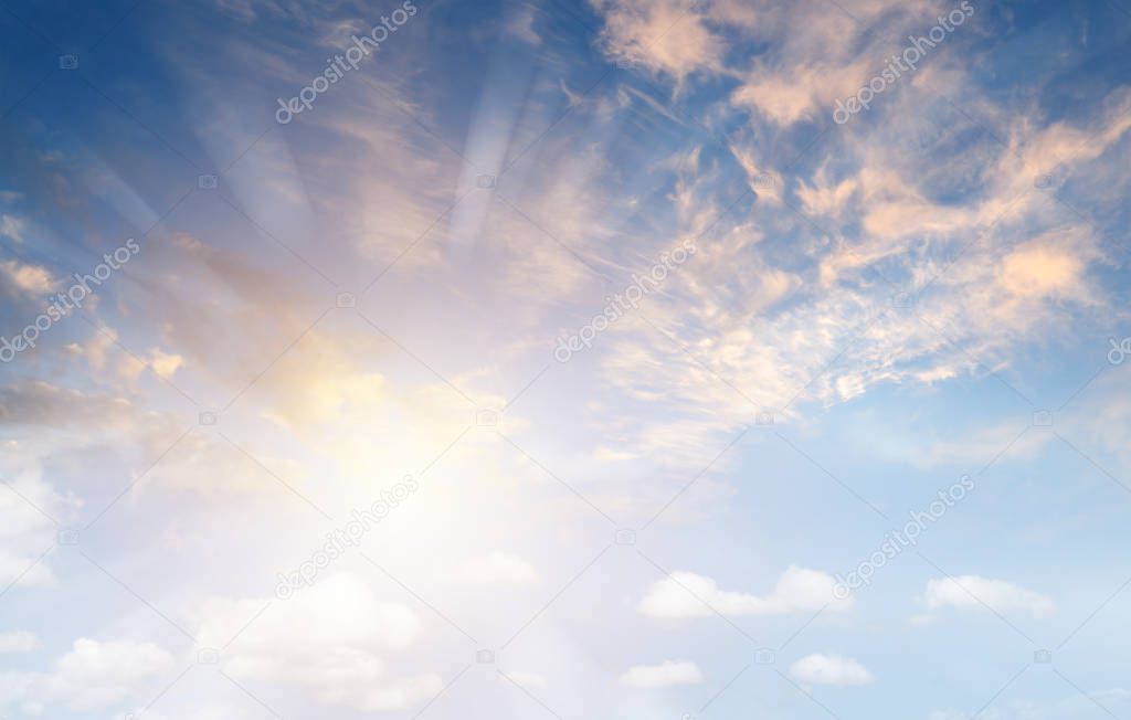 Sun rays shining in sky