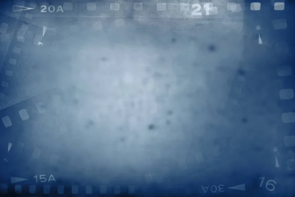 カメラ フィルムの負のフレームの青色の背景 — ストック写真