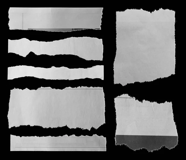 Siete Pedazos Papel Roto Sobre Negro —  Fotos de Stock