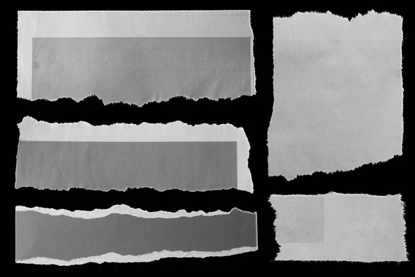 Papeles rotos sobre negro — Foto de Stock