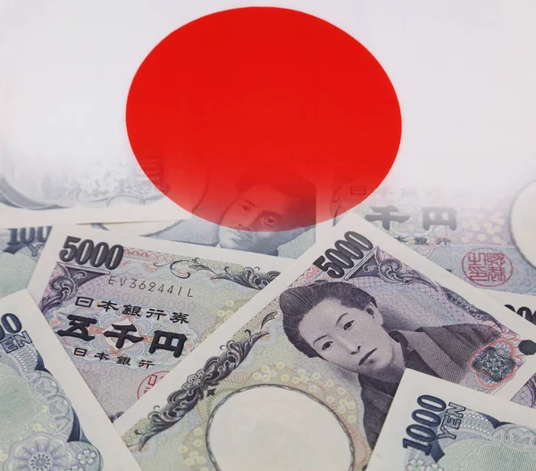 Banknoty Jena i flaga Japonii — Zdjęcie stockowe