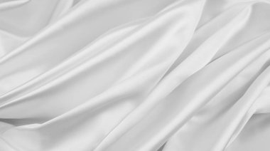 Dalgalanan beyaz ipek kumaş çizgilerinin yakınlaştırılması