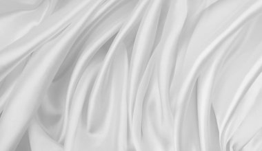 Dalgalanan beyaz ipek kumaş çizgilerinin yakınlaştırılması