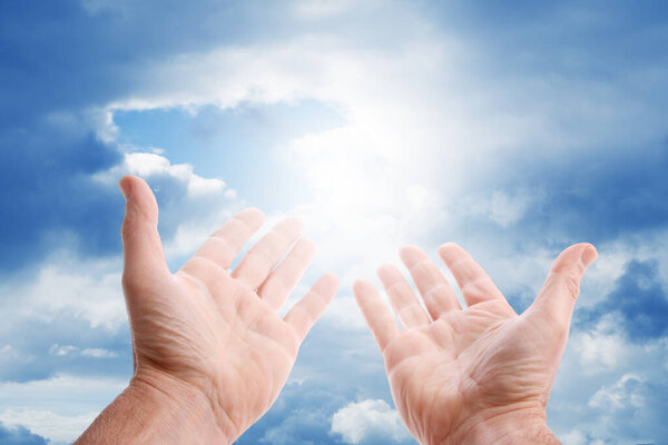 Open hands in the sky