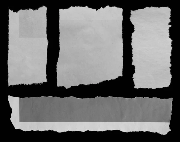 Four Pieces Torn Newspaper Black Background — Stock Photo, Image