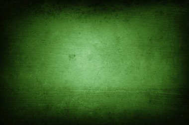 Yeşil çatlamış duvara yakın çekim. Koyu kenarlar