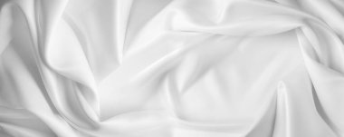 Dalgalı beyaz ipek kumaşın yakın çekimi