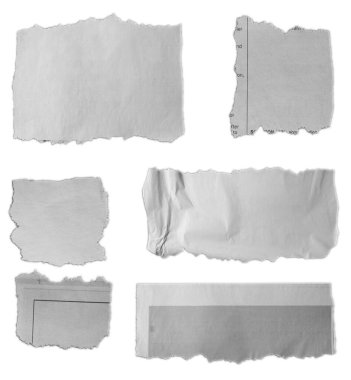 Beyaz arkaplanda altı parça yırtık kağıt