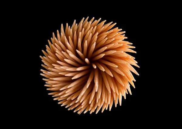 Tandpetare i form av en abstrakt blomma på en svart bakgrun — Stockfoto