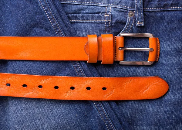 Red leather belt and blue jeans — Stock Photo, Image