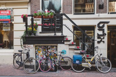 Bicycles parked near house in Amsterdam, The Netherlands