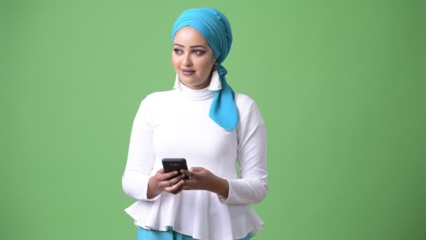 Young beautiful African Muslim woman against chroma key with green background — Stock Video