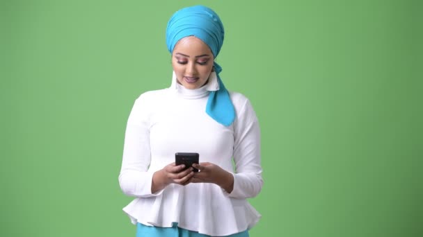 Young beautiful African Muslim woman against chroma key with green background — Stock Video