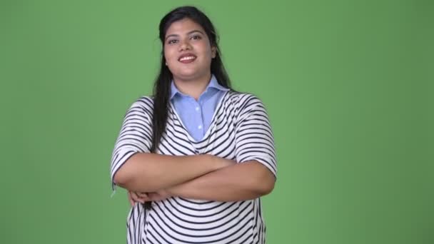 Young overweight beautiful Indian businesswoman against green background — Stock Video