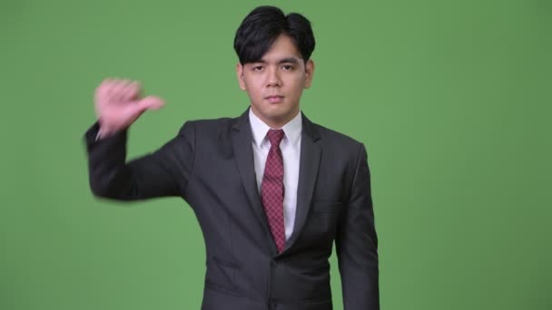 Młody Przystojny Azjatycki Biznes Biznesmen Przeciwko Kluczowanie Zielonym Tle Strzał — Wideo stockowe