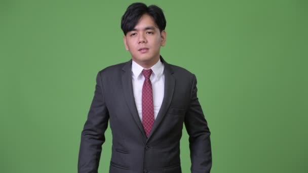 Stressato giovani bello asiatico uomo d'affari avendo collo dolore — Video Stock