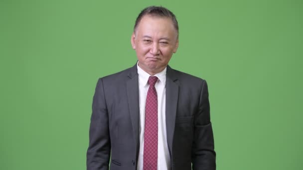 Ώριμη ιαπωνική επιχειρηματίας κουνώντας Ναι — Αρχείο Βίντεο