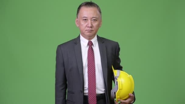 Mature Japanese businessman as engineer giving thumbs up — Stock Video