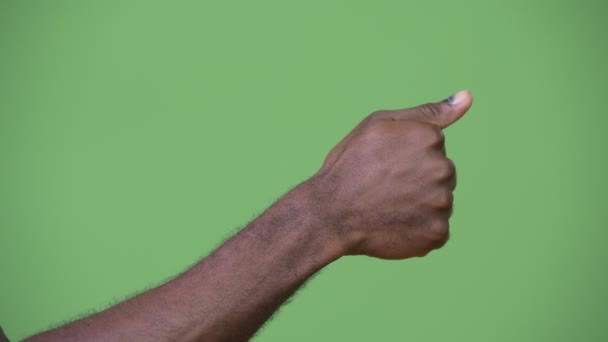 Hand of young African man giving thumbs up — Stock Video