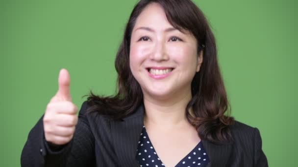 Érett gyönyörű ázsiai üzletasszony, ami remek — Stock videók