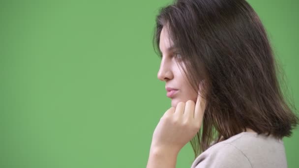 Profile view of young beautiful woman thinking — Stock Video