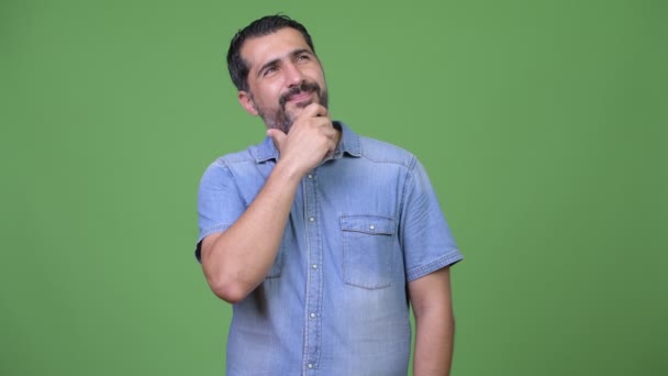 Handsome Persian bearded man thinking — Stock Video