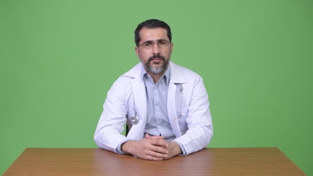 Handsome Persian bearded man doctor smiling — Stock Video