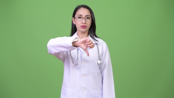 Jeune belle asiatique femme médecin donnant pouces vers le bas — Video