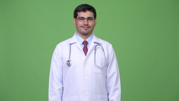 Young handsome Persian man doctor — Stock Video