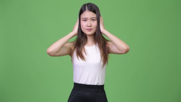 Young beautiful Asian businesswoman gesturing three wise monkeys concept — Stock Video