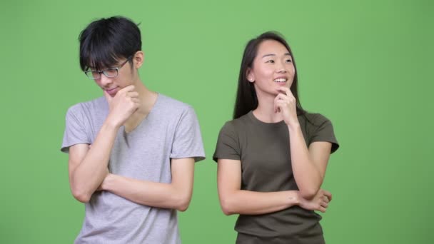 Jeune couple asiatique penser ensemble — Video