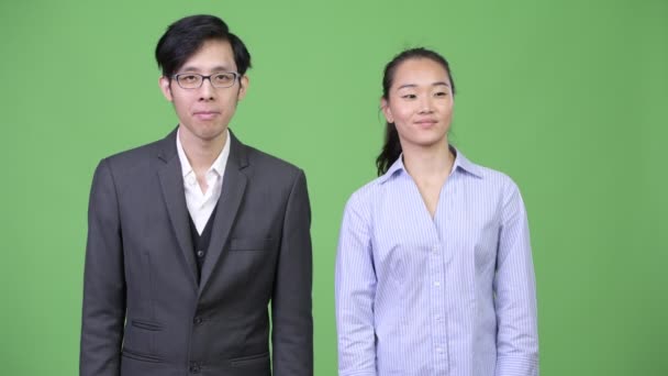 Young Asian business couple ready to fight together — Stock Video