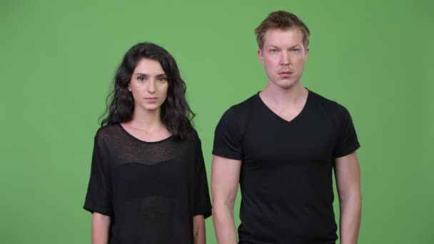 Young couple with arms crossed together — Stock Video