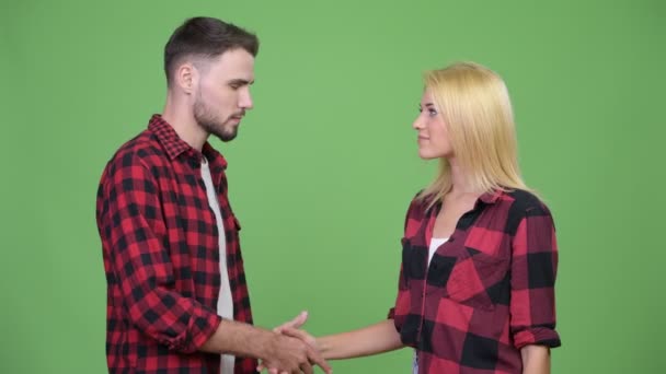 Young couple shaking hands together — Stock Video