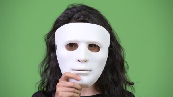 Young beautiful woman with white mask — Stock Video